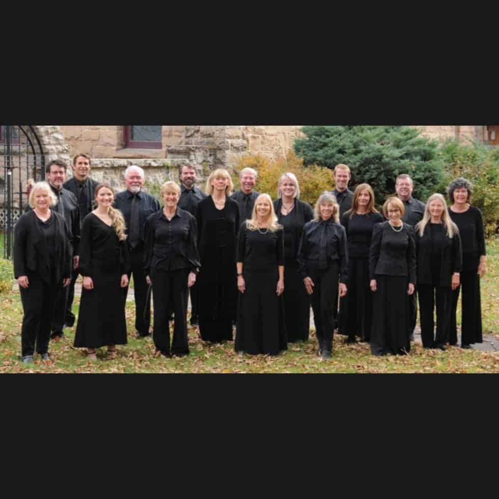 SJS Chamber Singer members stand for a portrait all wearing black